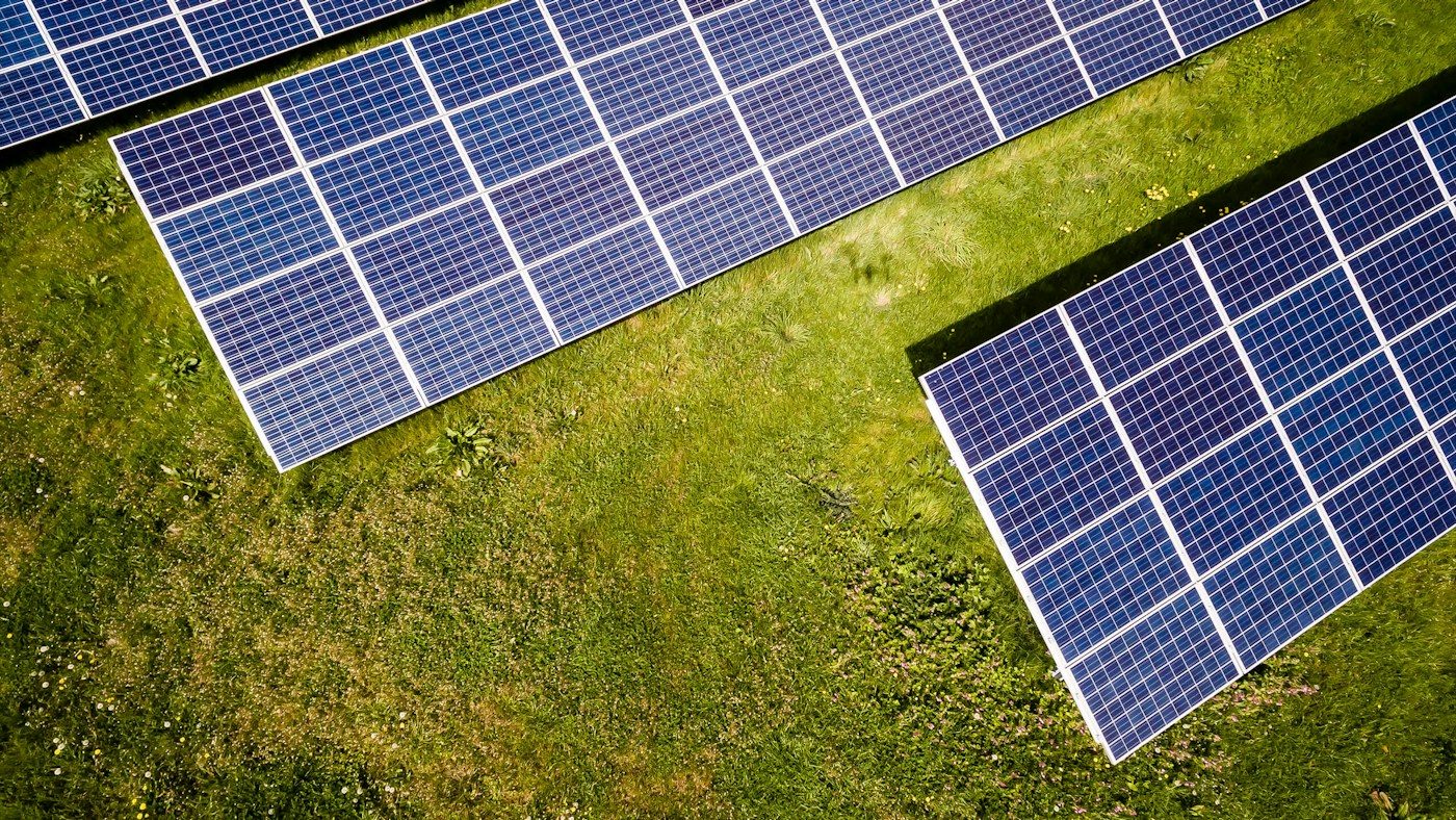 Solar panels on grass from above